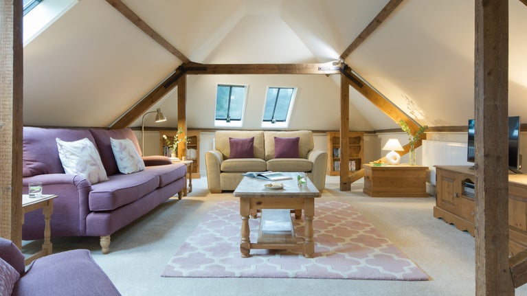 The sitting area in the open-plan room at Coach House Loft, Cambridgeshire